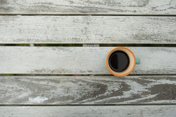 vintage cup of coffee on  white old wooden white table with top view