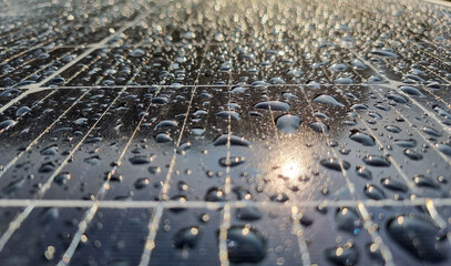 rain drops on the surface of a photovoltaic solar panel