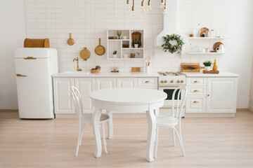 Cozy modern Scandinavian style kitchen with dining area, white modern interior