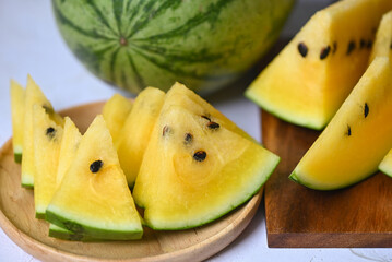 Sweet watermelon slices pieces fresh watermelon tropical summer fruit, Yellow watermelon slice on plate