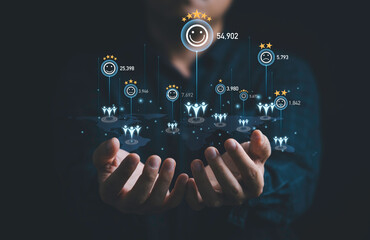Businessman holding virtual human icon with client evaluation rating status on world map for...