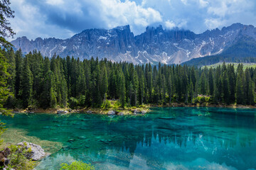 Blue lake in the Dolomites Italy, Carezza lake Lago di Carezza, Karersee with Mount Latemar, Bolzano province, South tyrol, Italy.