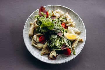 Salad with seafood and vegetables in a bowl