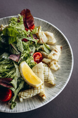 Salad with seafood and vegetables in a bowl