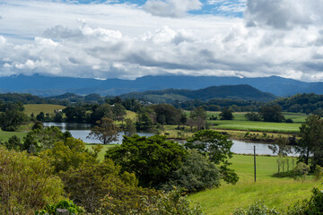 Fototapeta na wymiar View of the Tweed Valley, from Tweed Regional Valley, with mountains of Lamington National Park and Springbrook Plateau on the horizon. Murwillumbah, New South Wales, Australia
