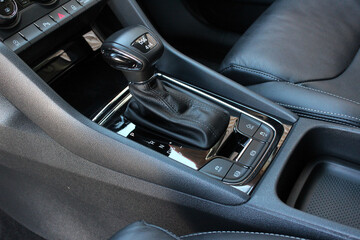 Obraz na płótnie Canvas DSG automatic transmission. DSG Direct-shift gearbox. Gear lever close up. Modern Automatic Transmission in Car. Luxury car interior with leather car interior.