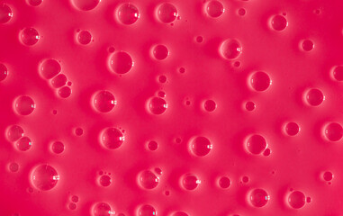 Bubble pink background texture. Berry gel to cleanse the skin of the face and body. Spa treatments, skin care. Bath foam, detergent. Slime pink.