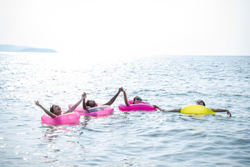 Holiday summer with friends on the beach,Having fun in the sea,Lifestyle people vacation holiday on beach.