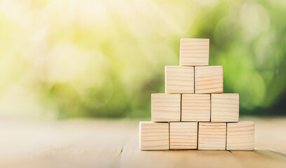 Ladder career path for business growth success process concept. Wooden blocks are stacked in steps that continue to rise. Copy space