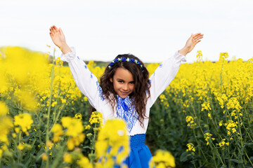 Naklejka premium Pray for Ukraine. Stop war. Ukraines Independence Day. Constitution day. Ukrainian girl in embroidered shirt vyshyvanka. Ukrainians are against war.