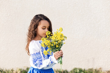 A little girl in Ukrainian national dress. Ukraine. Stop wor