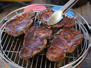 Entrecote steak on a camping grill