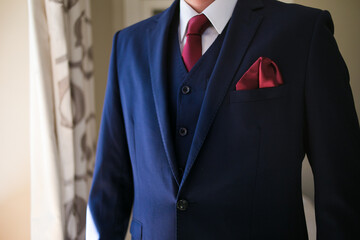 Close up creative image of a Groom's Wedding Attire at a real wedding