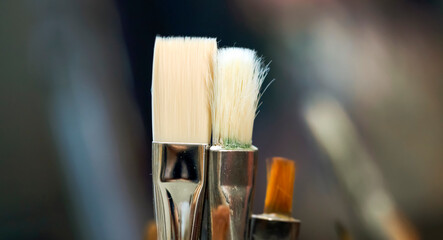 Brushes for painting, creative artworks closeup.
