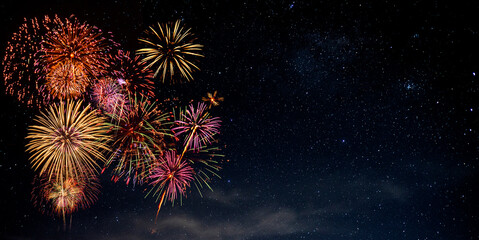 Fototapeta premium Fireworks with blur milky way background
