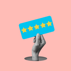 black and white hand holds a sign with five stars