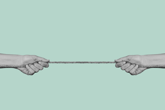 two men pulling the ends of a rope