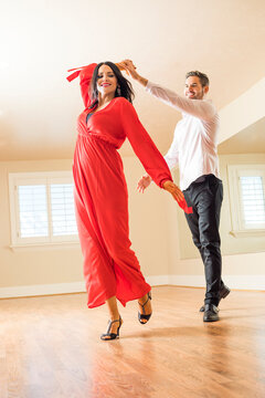 Couple dancing in empty apartment&nbsp;