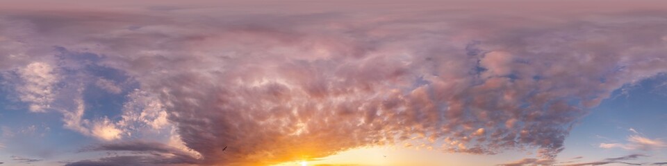 Bright sunset sky panorama with glowing red pink Cumulus clouds. HDR 360 seamless spherical panorama. Sky dome or zenith in 3D, sky replacement for aerial drone panoramas. Climate and weather change.