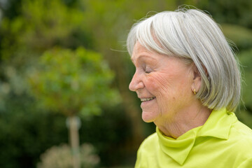 Elderly lady in her early 80s with white gray hair