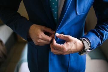 Close up creative image of a Groom's Wedding Attire at a real wedding