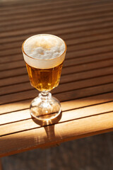 Top view of cold lager beer on wooden table. Pale Ale amber beer close up
