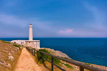 Fototapeta na wymiar lighthouse on a rock coast looking at the horizon 
