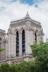 Paris, France - May 31, 2022: The facade and towers of Notre Dame are a symbol of renewal, reconstruction and resilience - reopening soon after restoration