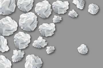 Lot of Crumpled white paper isolated on gray background. Paper crumpled into a ball.Copy space. Recycling, ecology, business.