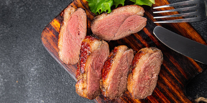 roasted duck breast meat poultry meal food snack on the table copy space food background rustic top view