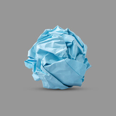 Fototapeta premium Crumpled blue paper isolated on gray background. Paper crumpled into a ball. Recycling, ecology, business.