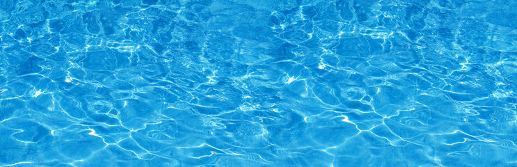 Transparent blue colored clear water surface texture with splashes.  Water background, ripple and...
