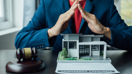 Legal consultant and real estate attorney lawyer read the building lease contract signing agreement for local business.