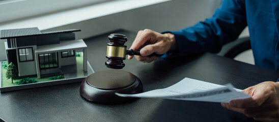 Legal consultant and real estate attorney lawyer read the building lease contract signing agreement for local business.