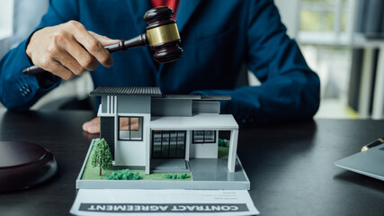 Legal consultant and real estate attorney lawyer read the building lease contract signing agreement...