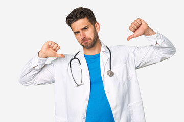 Fototapeta premium Young doctor man feels proud and self confident, example to follow.