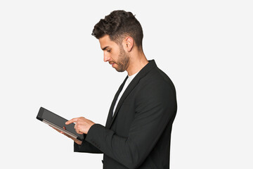 Young businessman excelling in his work, utilizing a tablet with modern technology for enhanced productivity and organization.