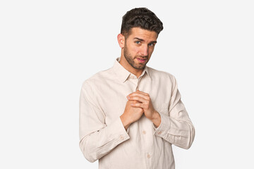 Young handsome man isolated scared and afraid.