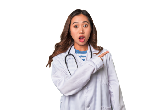 A young asian doctor woman pointing to the side - Powered by Adobe