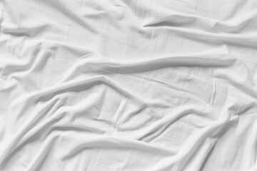 White wrinkled fabic texture rippled surface,Close up unmade bed sheet in the bedroom after night...