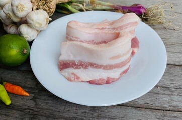 Pork belly raw on wood background