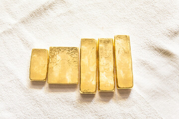 Pure ingots gold on the white background