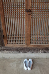 Fototapeta na wymiar Korean Traditional house room doors and rubber shoes