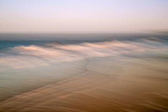 Abstract artistic image of beach scene with intentional camera movement (ICM). Motion blur creates dreamlike art