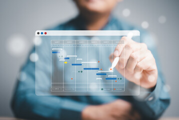 Project management or Engineering proceeding concept. Site manager working with Gantt chart...