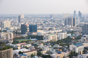 Fototapeta na wymiar Aerial view of Bangkok's cityscape in central downtown. It's include a tallest hotel and modern office building in the city
