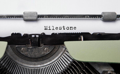 Text Milestone typed on retro typewriter
