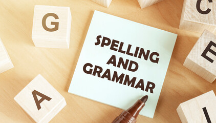 Sticker with text Spelling and Grammar in the middle of wooden cubes with letters