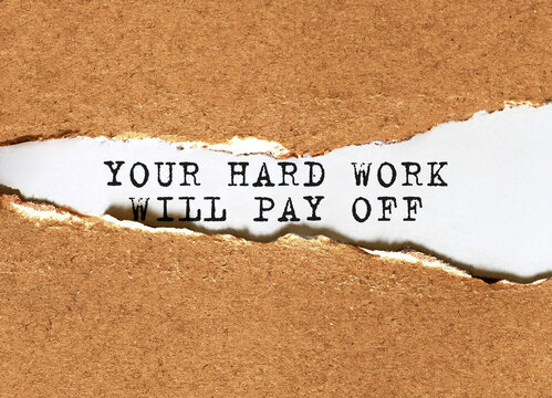 Naklejka Text Your hard work will pay off appearing behind torn brown paper