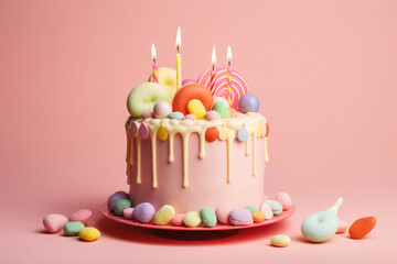 Colorful Birthday Cake with Frosting and Candy on Pastel Pink Background